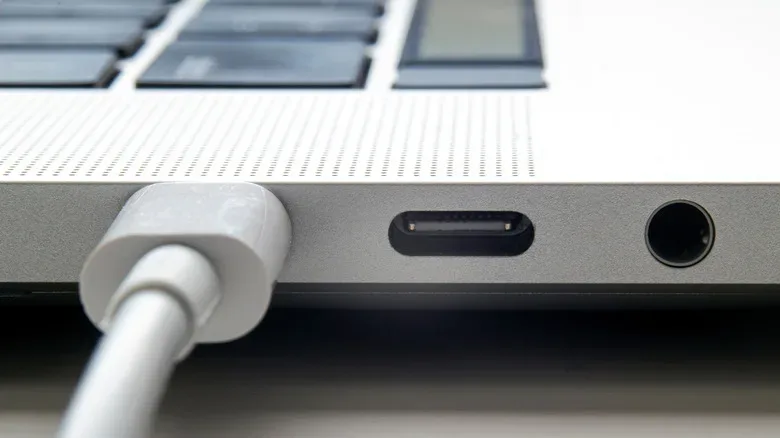 A USB-C cable plugged into a MacBook.