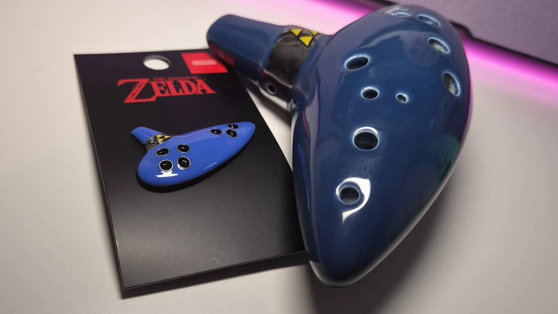 Official Ocarina of Time metal pin with blue finish and black backing