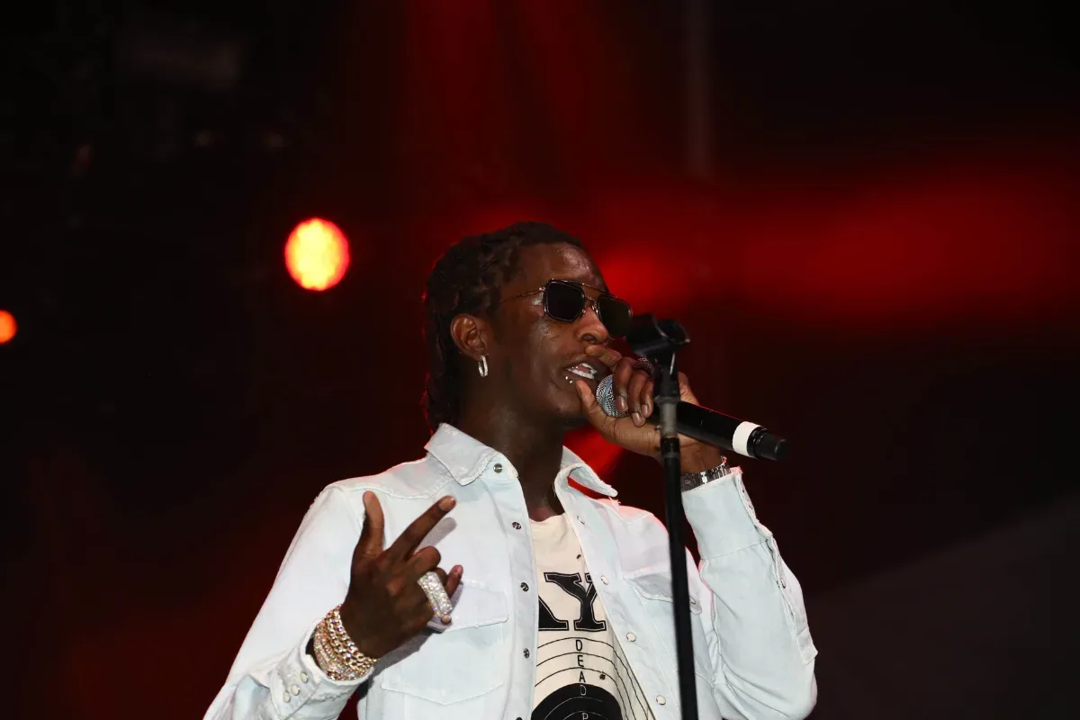 Young Thug speaking with participants at an Atlanta youth outreach event