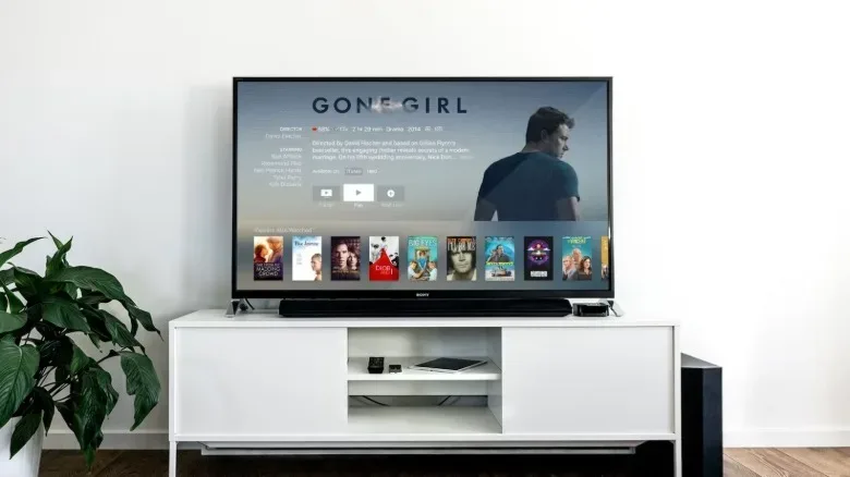 An Apple TV being used and showing menus.