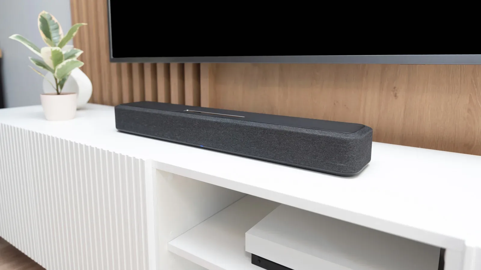 A gaming television setup with a soundbar positioned beneath the screen
