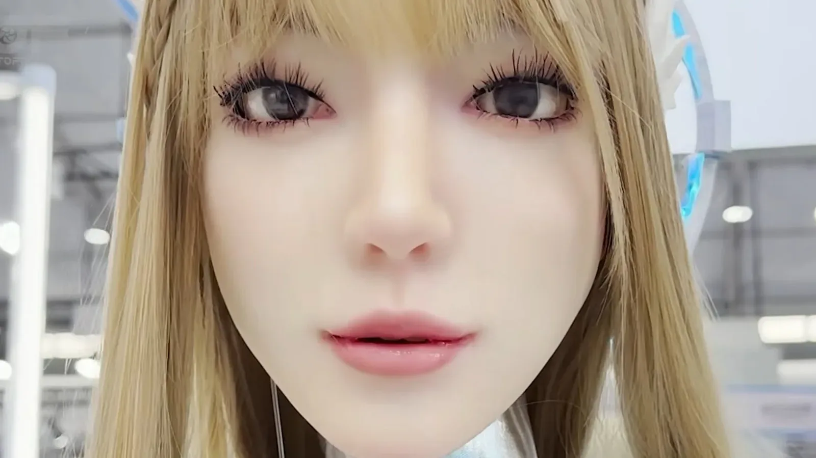 Yansyn-X2 humanoid robot displaying a sad facial expression and a tear