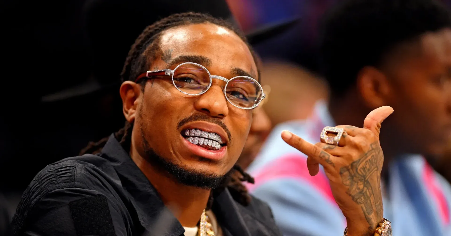 Quavo holding his daughter in a family-focused short film connected to QRÖMELIFE