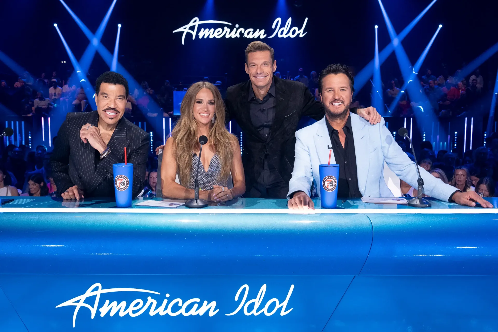 American Idol-style live television stage with illuminated performance lighting