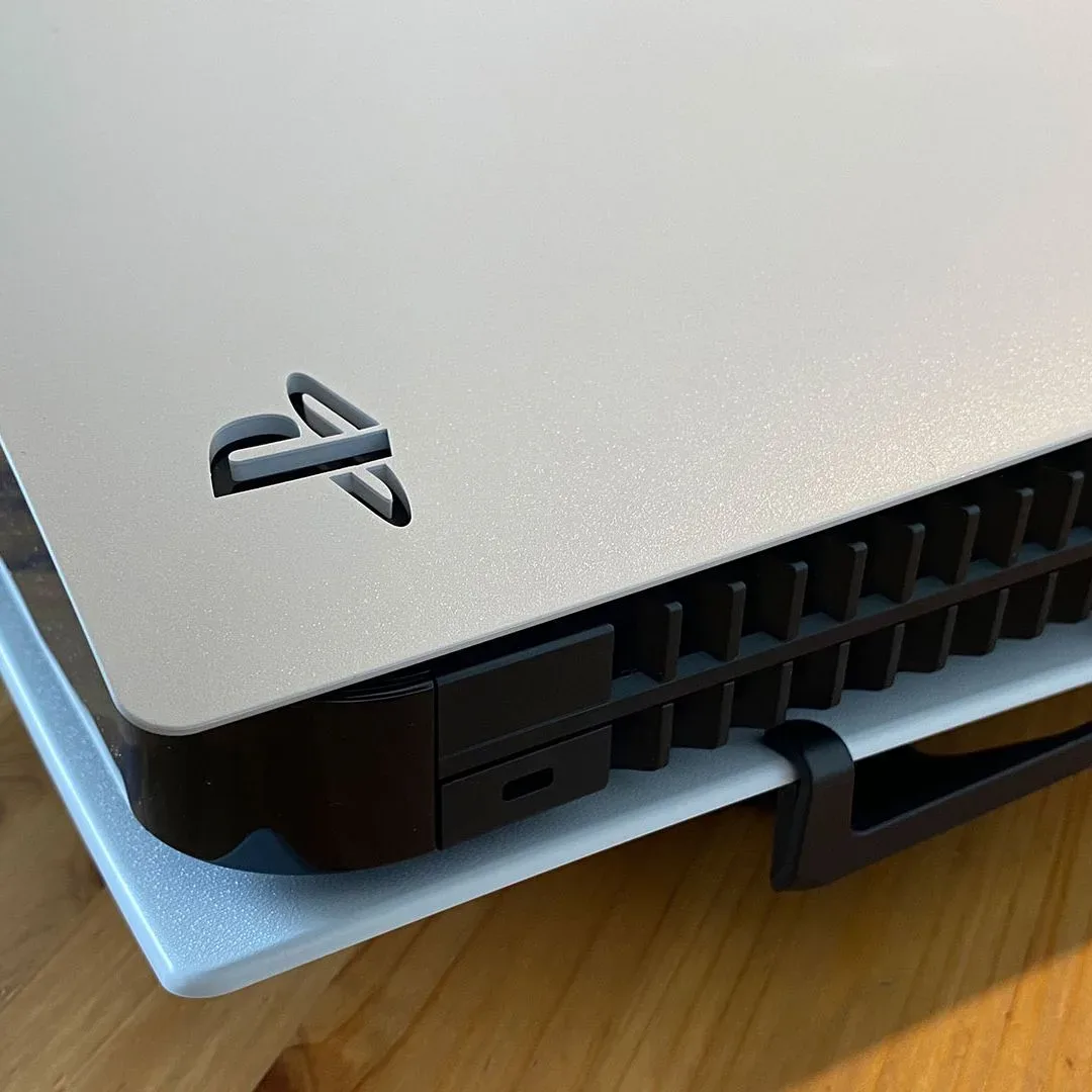 Conceptual illustration of PS5 homebrew development and code review on a computer screen