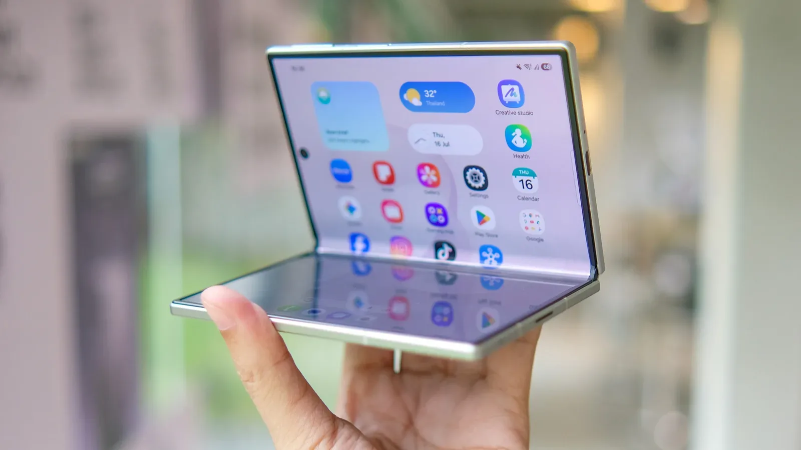 A foldable smartphone opened to its large inner display