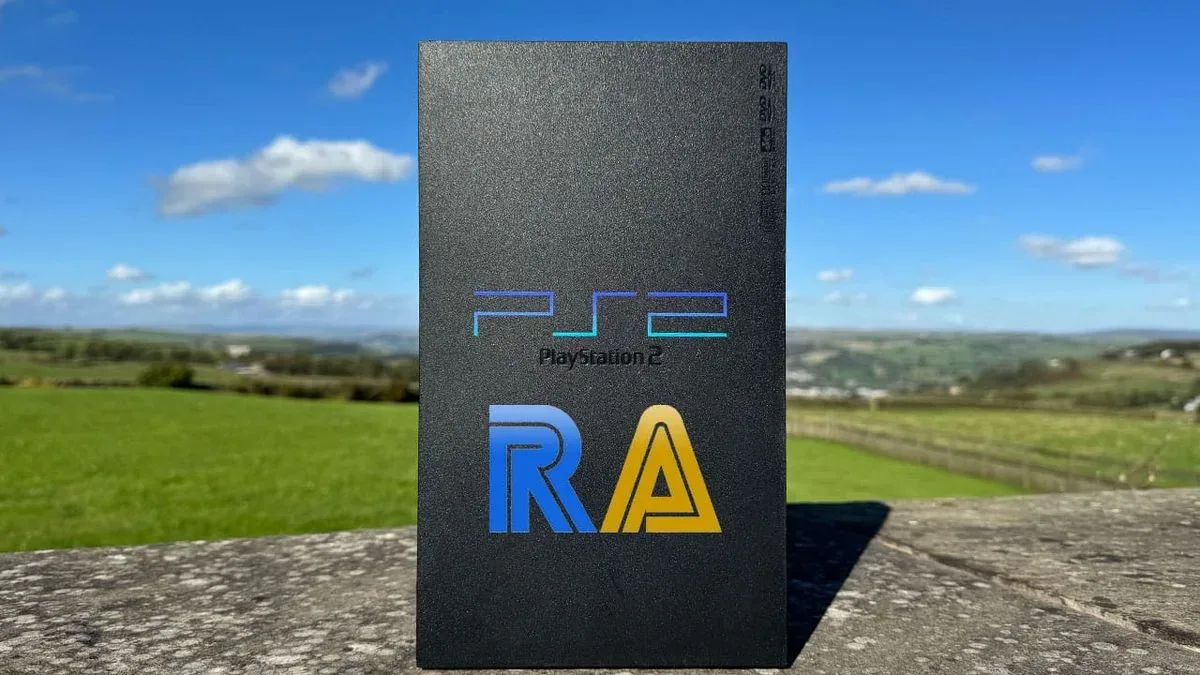A PlayStation 2 console connected to a television while RetroAchievements unlock tracking runs through a PC companion