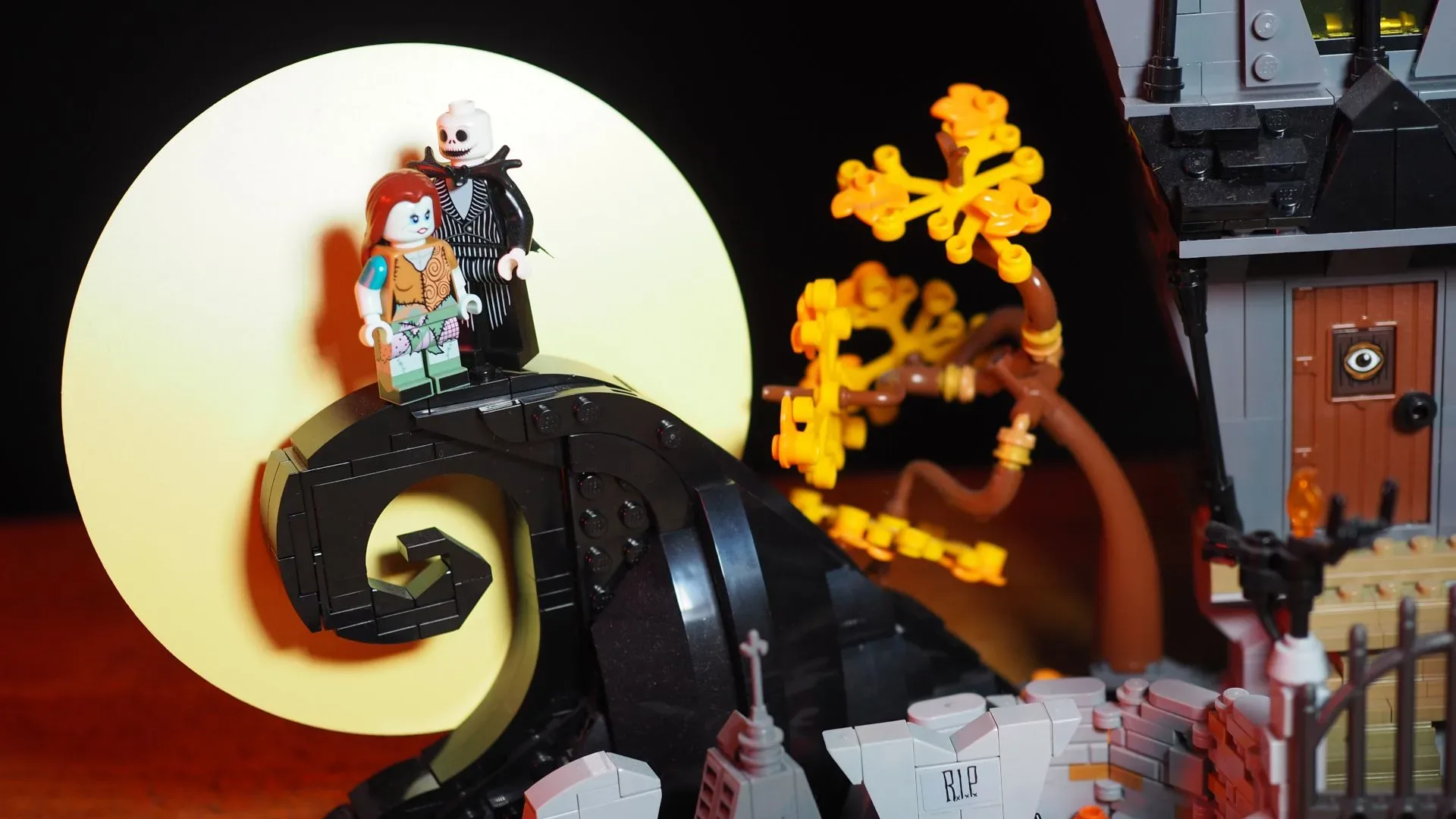 LEGO The Nightmare Before Christmas display set featuring the curled hill, Jack Skellington’s house, and Halloween Town hall