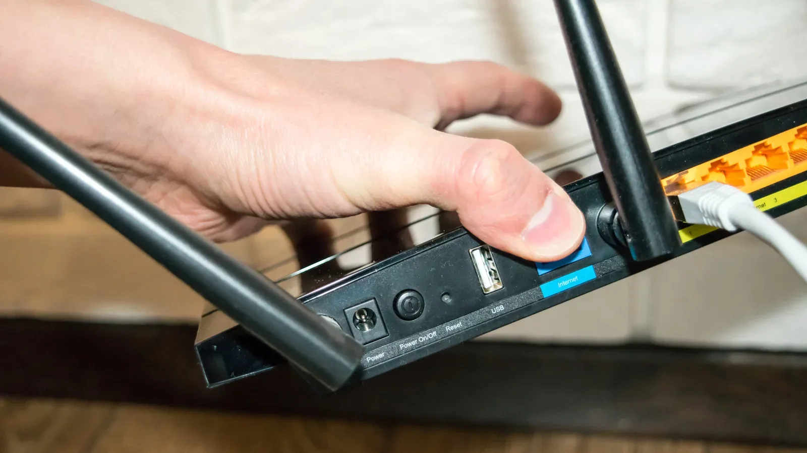 USB port beside Ethernet ports on a home Wi-Fi router