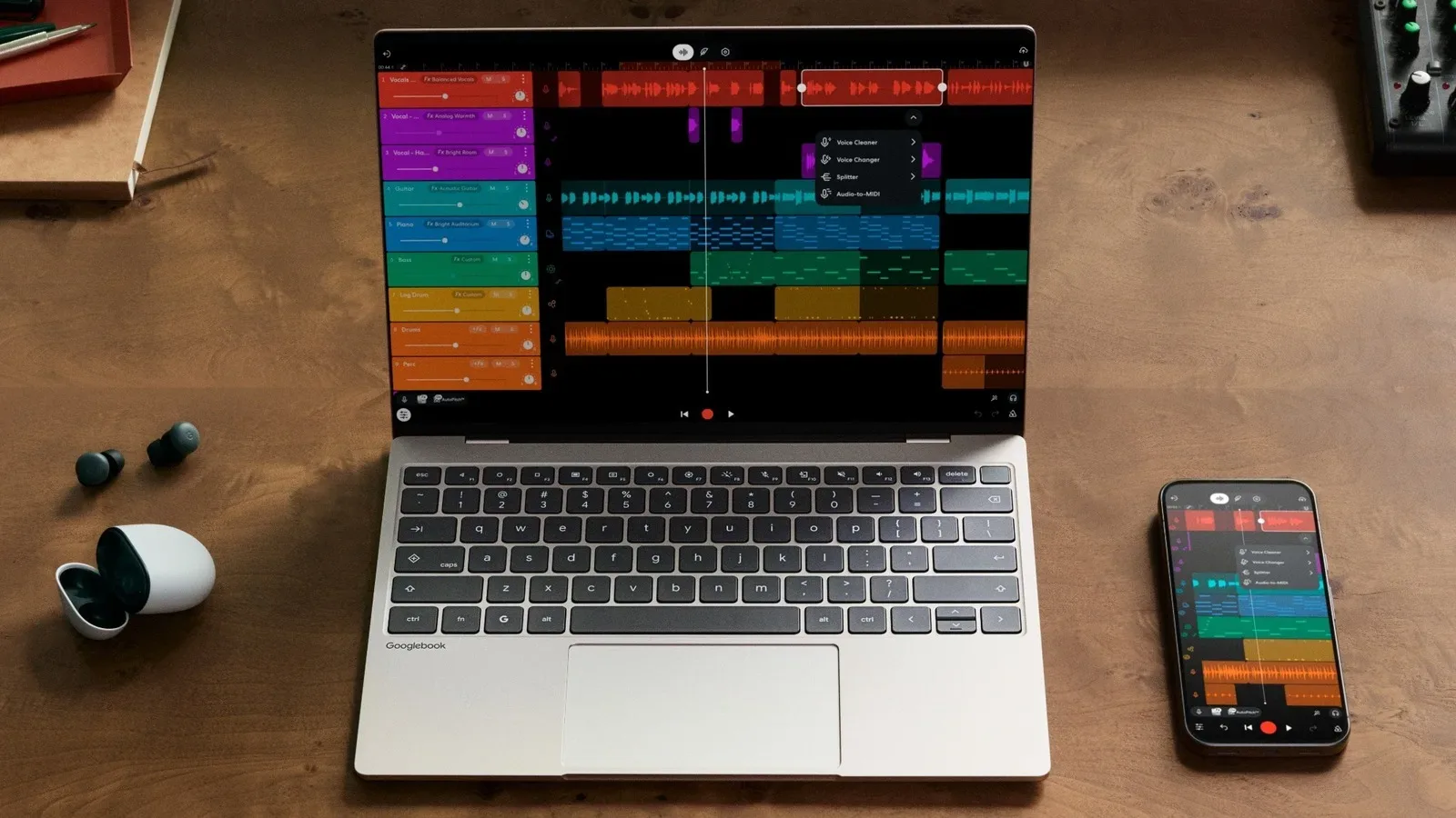 A Googlebook laptop displaying Android phone integration controls in its dock