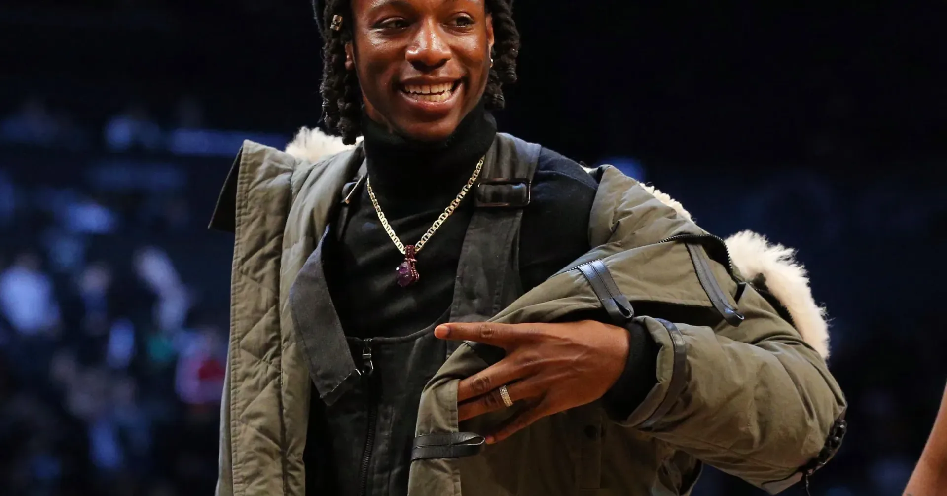 Joey Bada$$ performing onstage with a live band