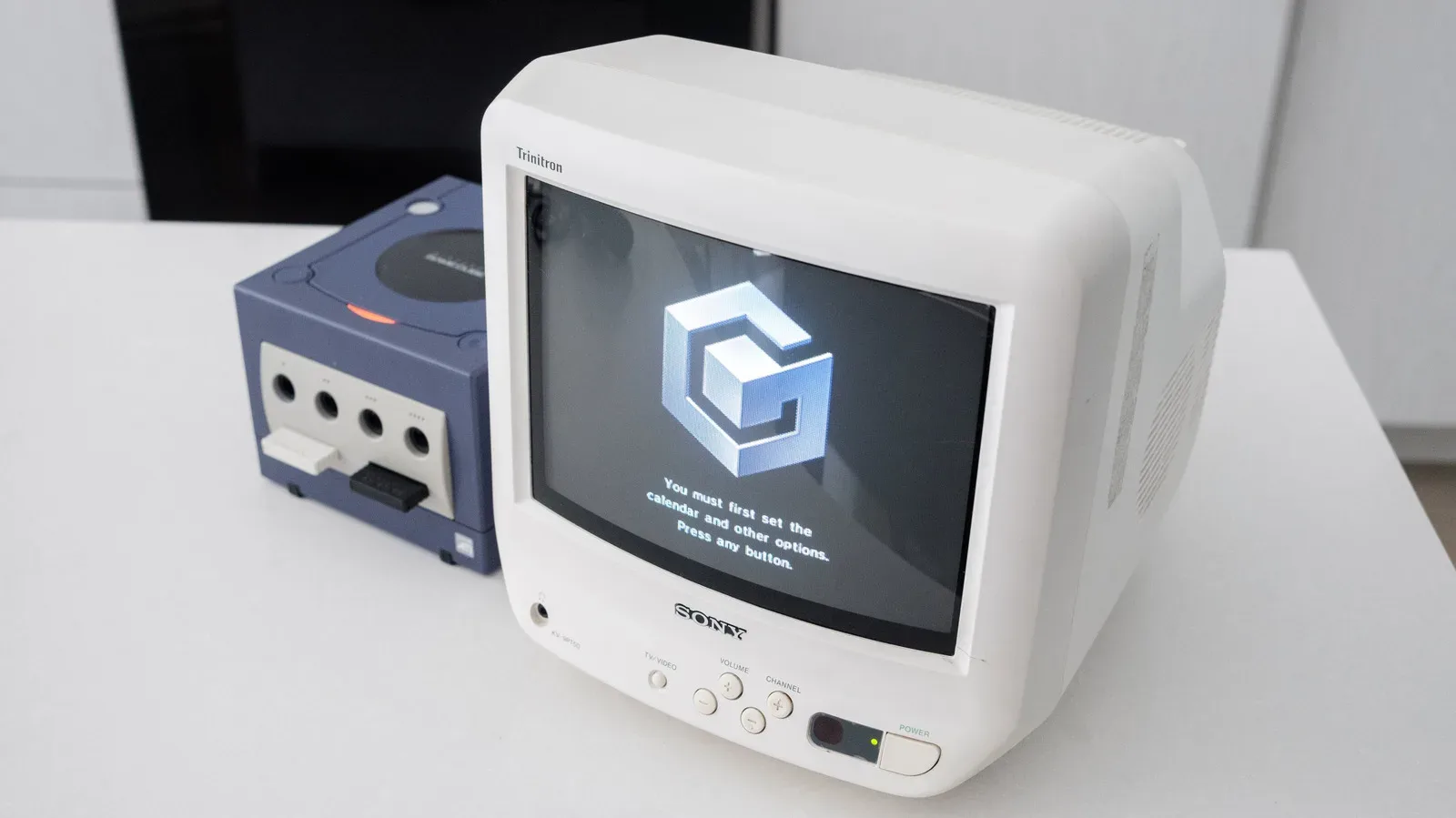 A purple Nintendo GameCube console with controller