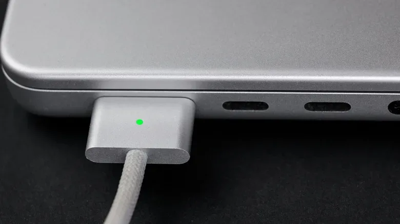 USB-C cable connected to a MacBook for charging