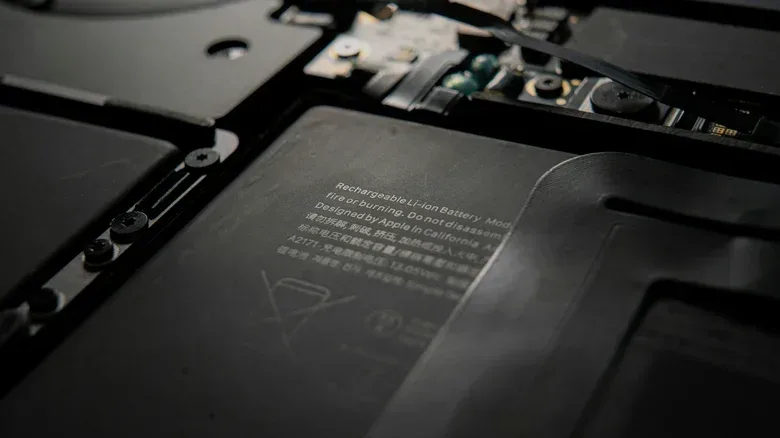 Closeup of an exposed MacBook's battery