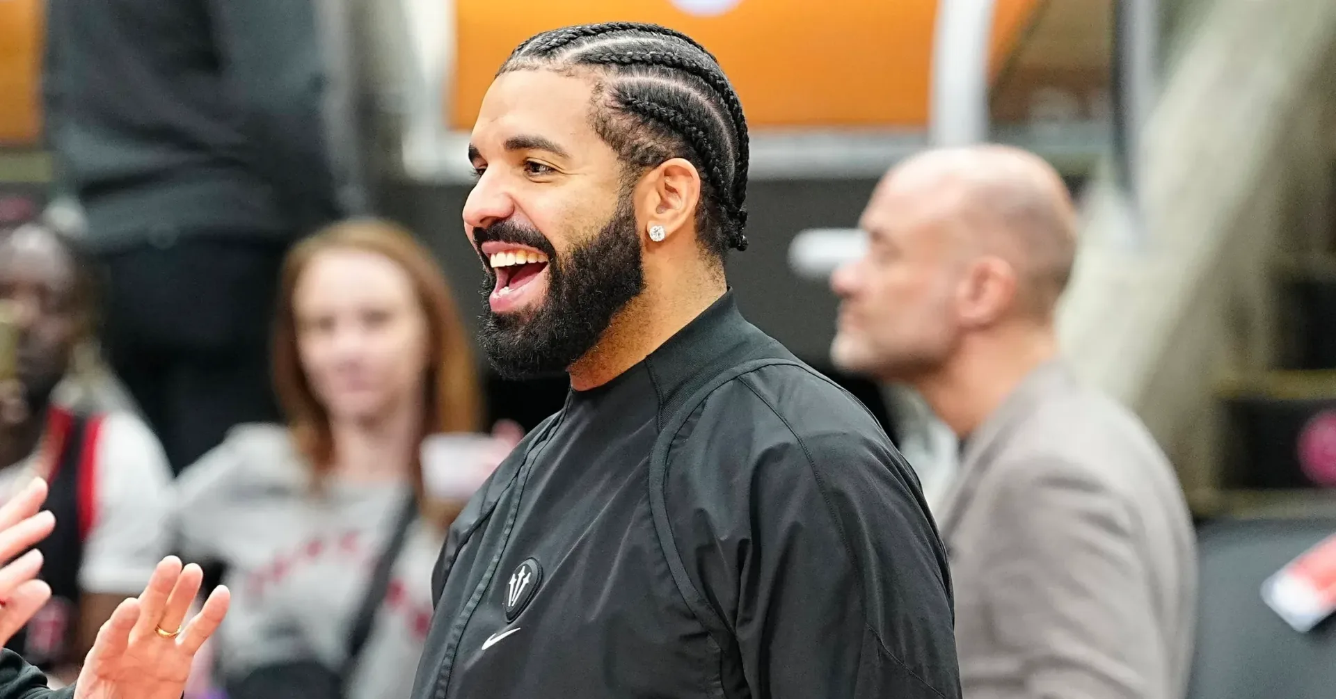 Drake at a DJ booth during a venue appearance