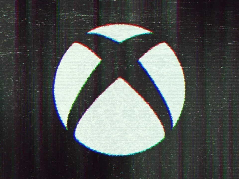 Xbox controller beside a screen showing a game library