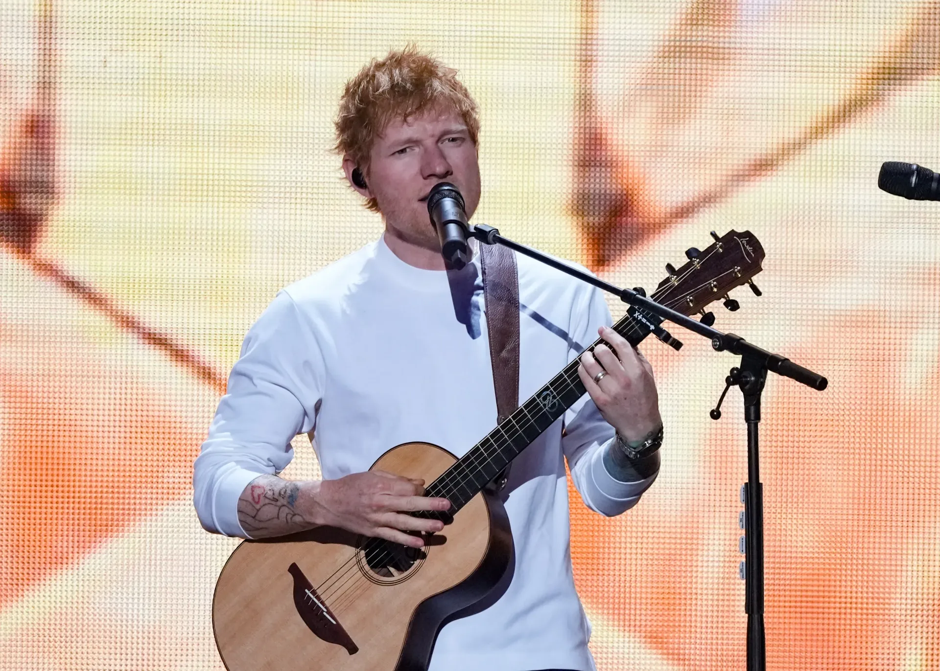 Ed Sheeran performing during the Loop Tour at a stadium concert