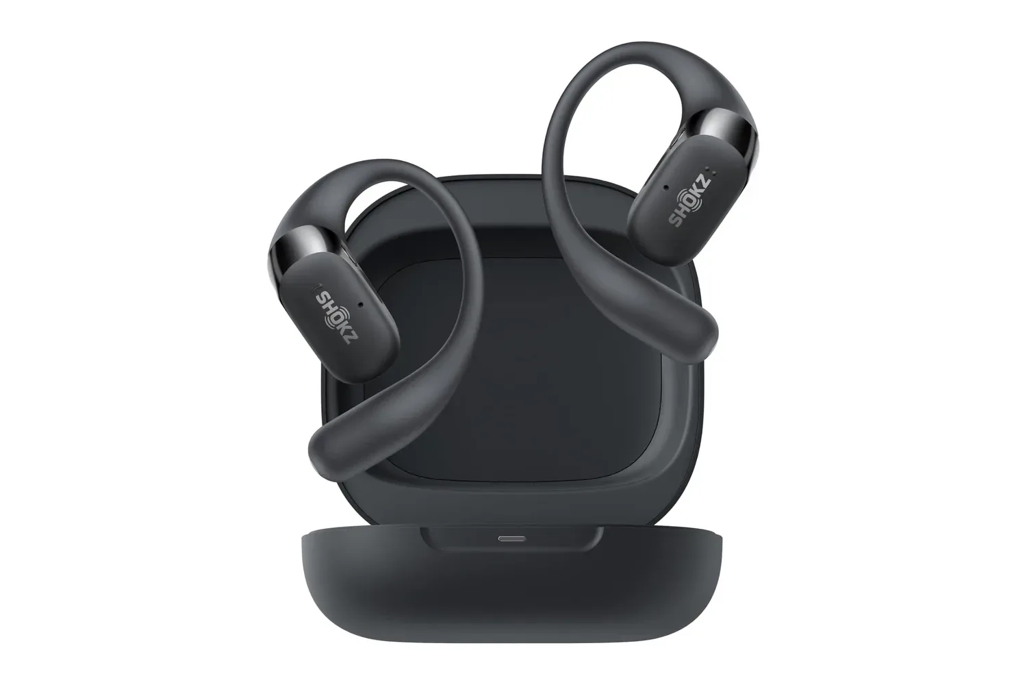 Shokz OpenFit 2 open-ear earhook earbuds resting outside the ear canal