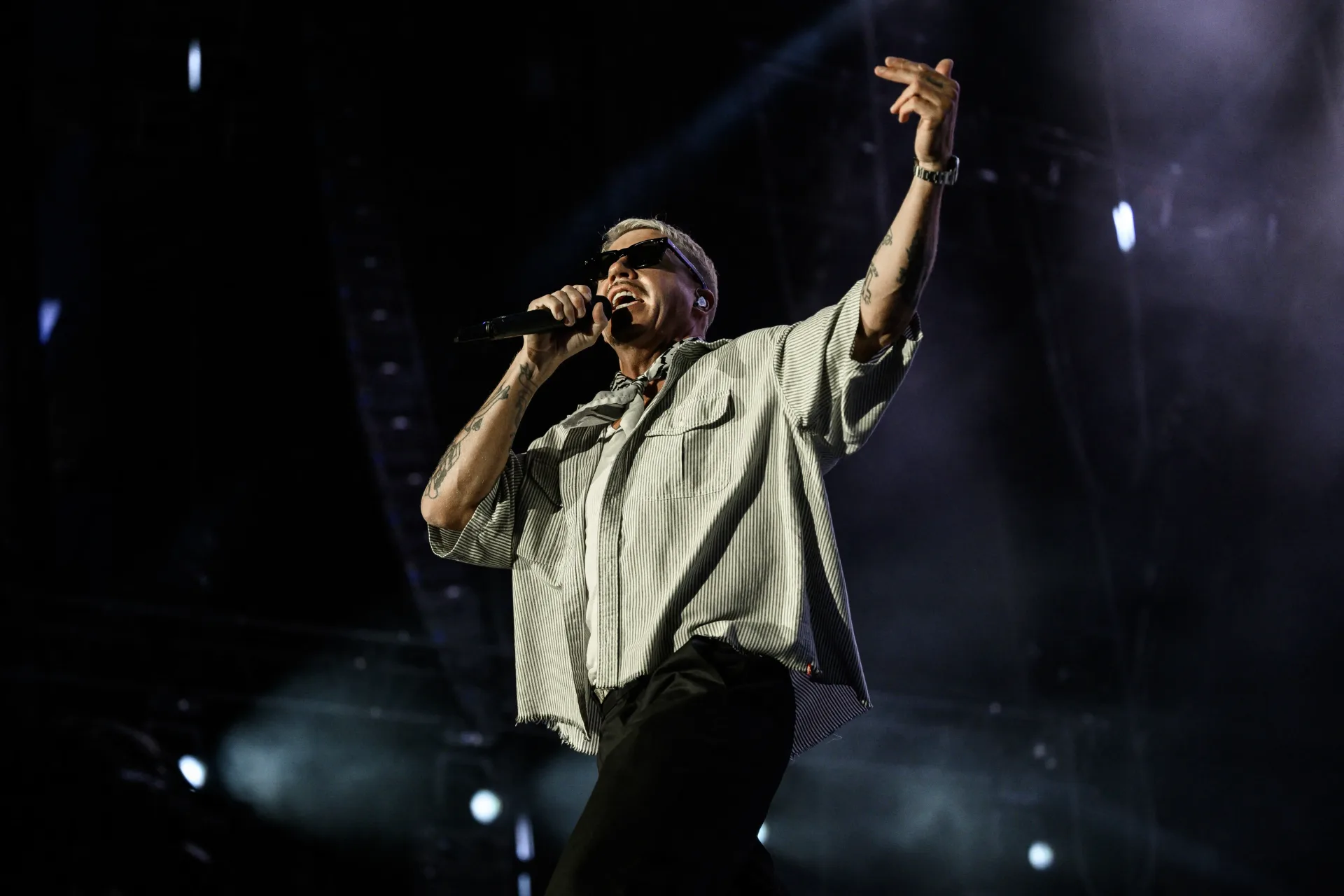 Macklemore performs onstage during a live concert