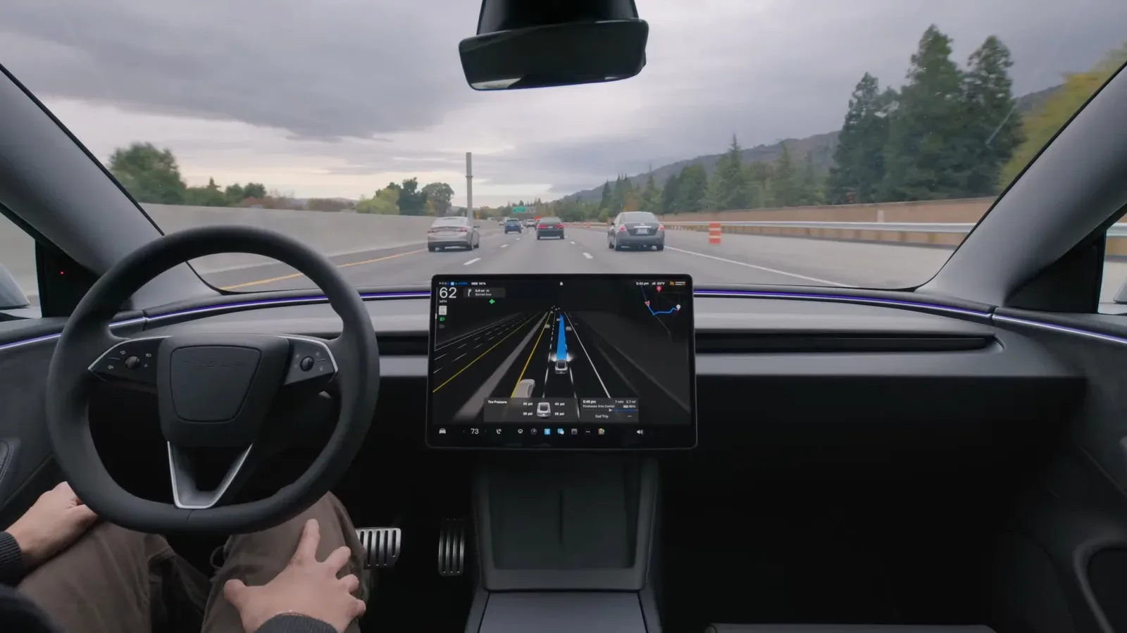 Tesla vehicle driving on a Czech road under FSD Supervised driver-assistance oversight