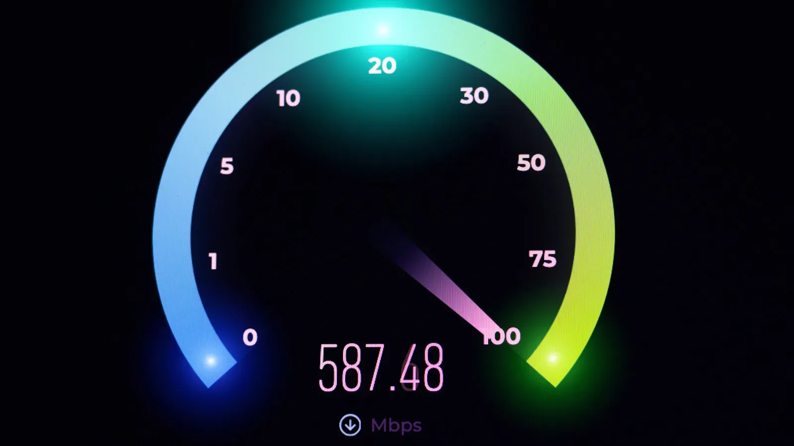 Ethernet-connected gaming PC beside a Wi-Fi router during an internet speed test