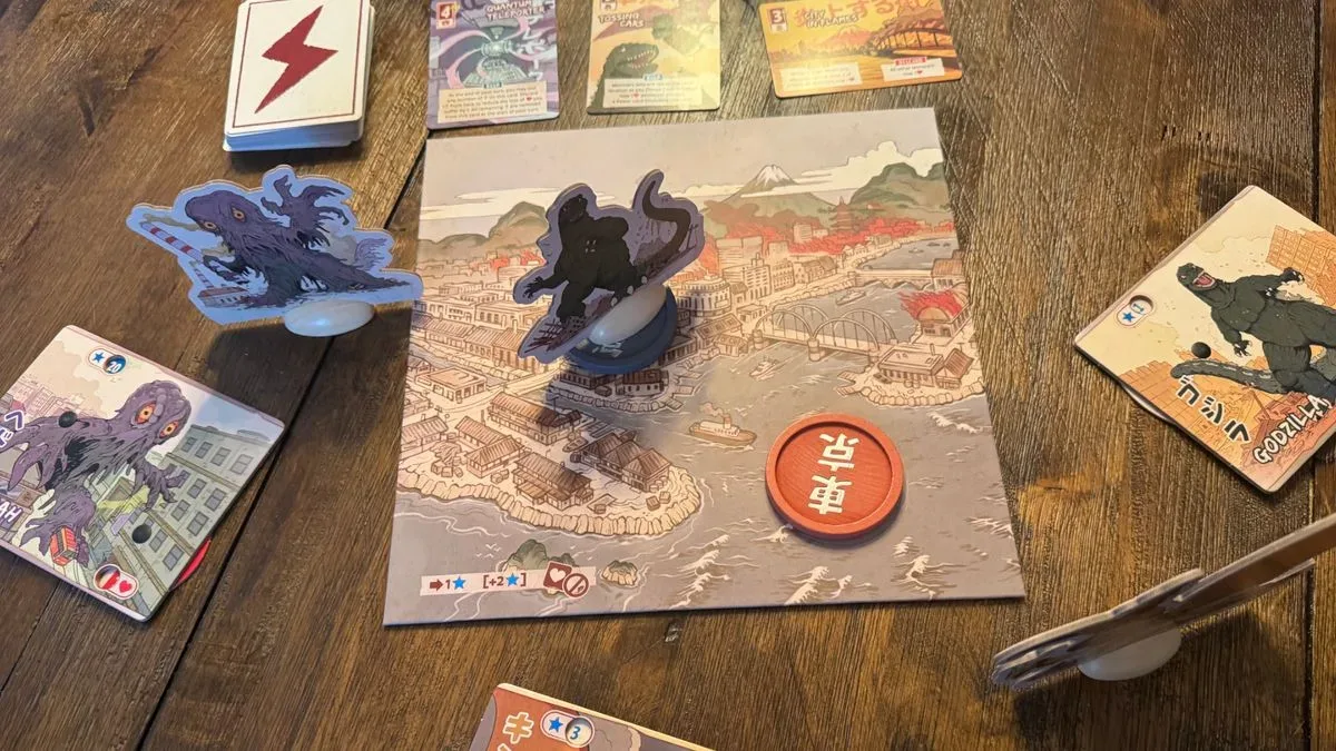 King of Tokyo: Godzilla board, cards, and tokens on a wooden surface