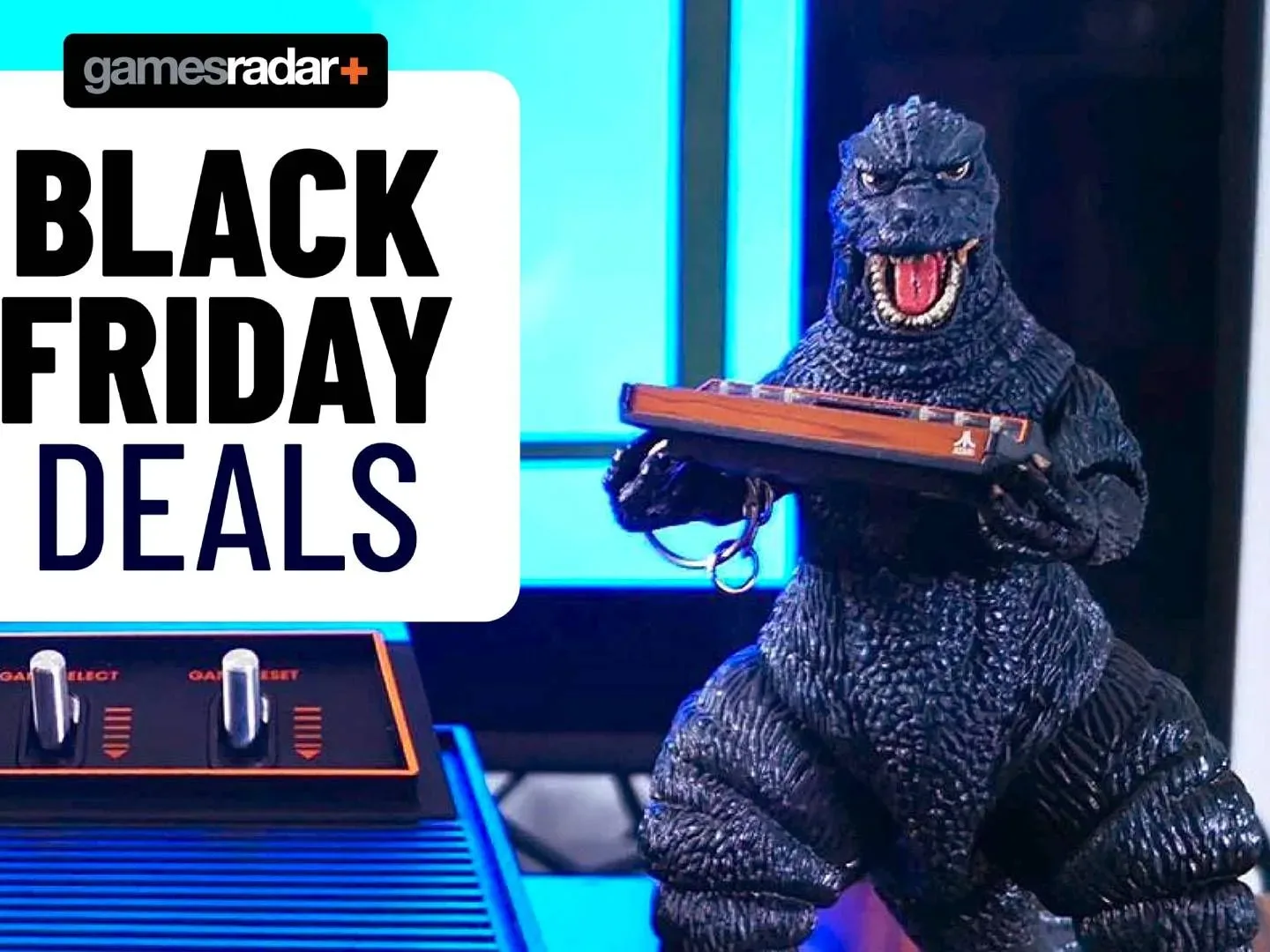 Black Friday deals GamesRadar+ badge on left and Godzilla holding a tiny Atari 2600+ on right.