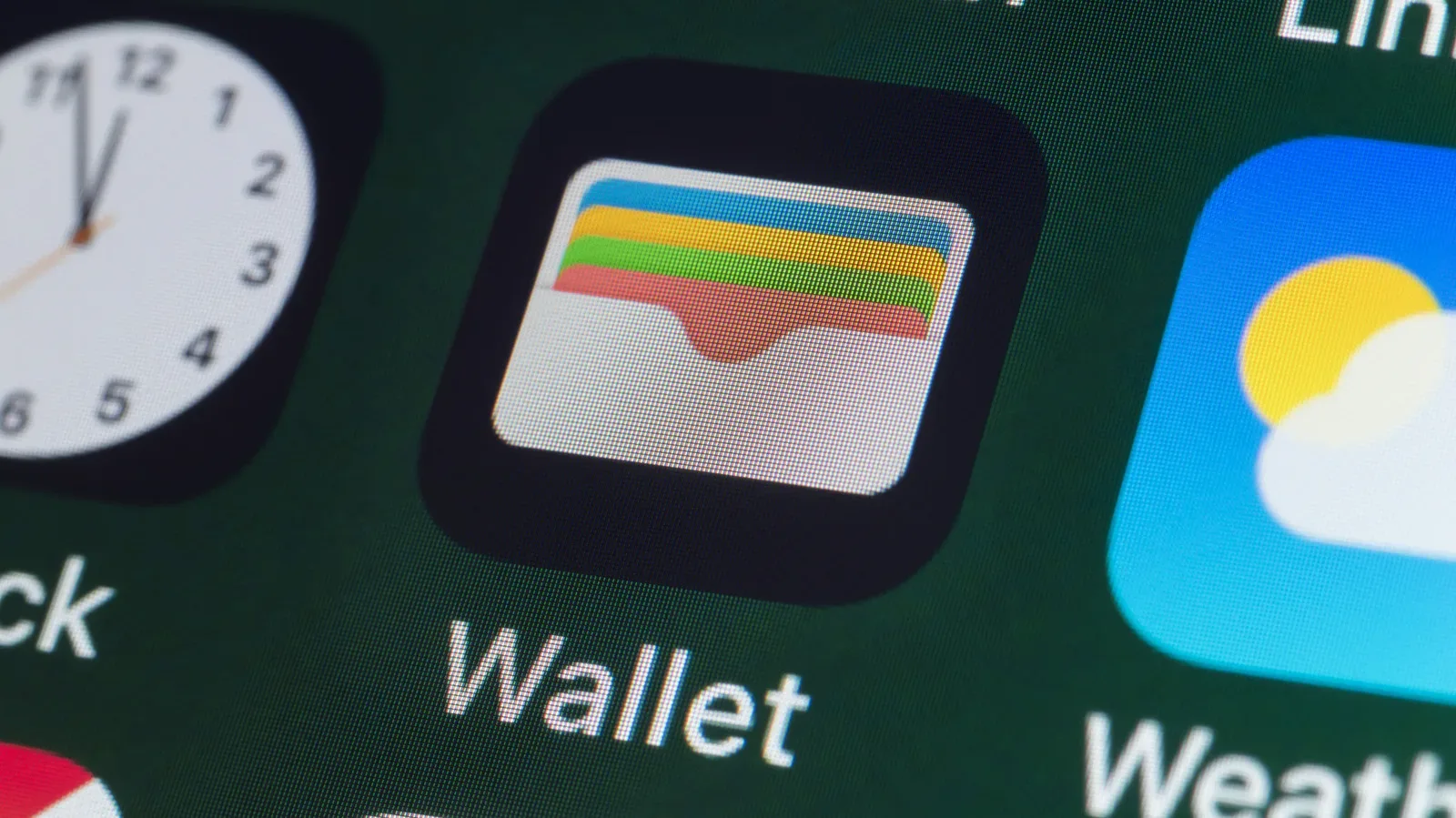 An iPhone displaying payment cards in the Apple Wallet app