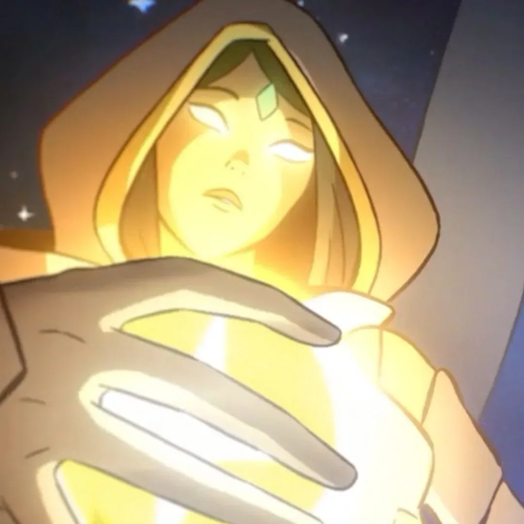 A raven-haired character in a hood is illuminated by a bright yellow light in the intro to Shape of Dreams.