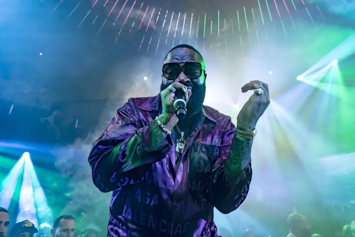 Rick Ross performing onstage during a live concert