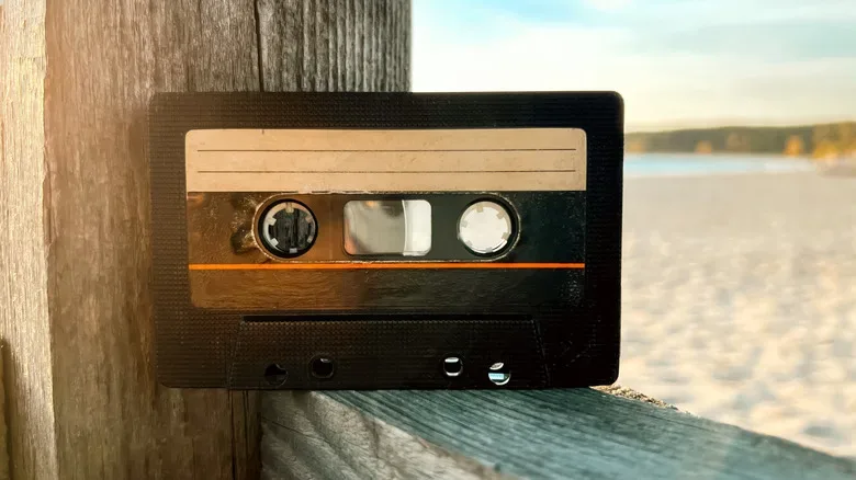 Close-up of a cassette tape reel and magnetic tape