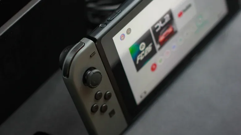 Nintendo Switch OLED shown in handheld mode with its 7-inch display