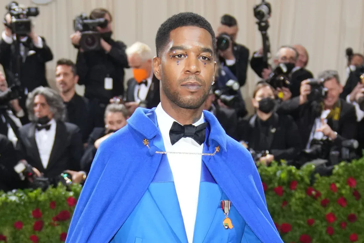 Kid Cudi performing onstage during a concert