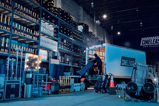 Film lighting and grip equipment arranged on a production set