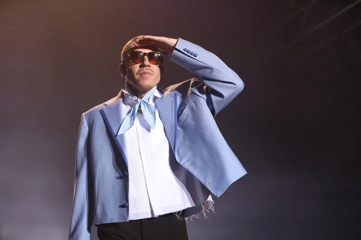 Macklemore performing during a stadium concert