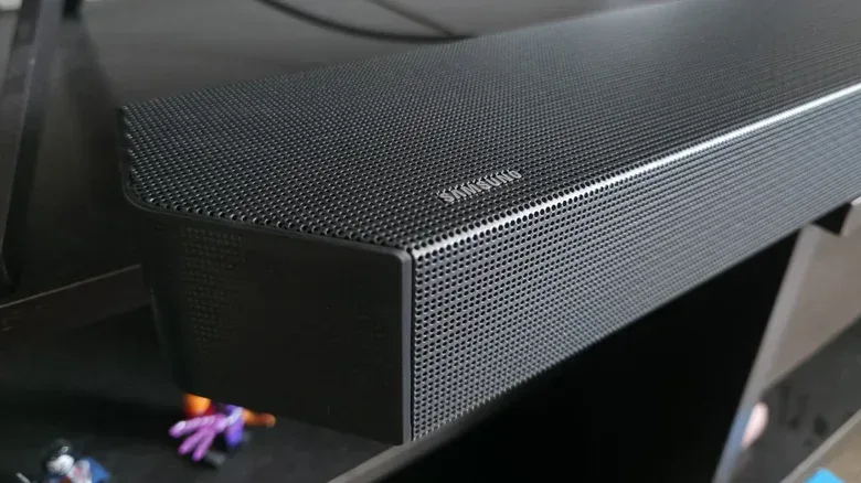 A Dolby Atmos soundbar with upward-firing speakers beneath a television