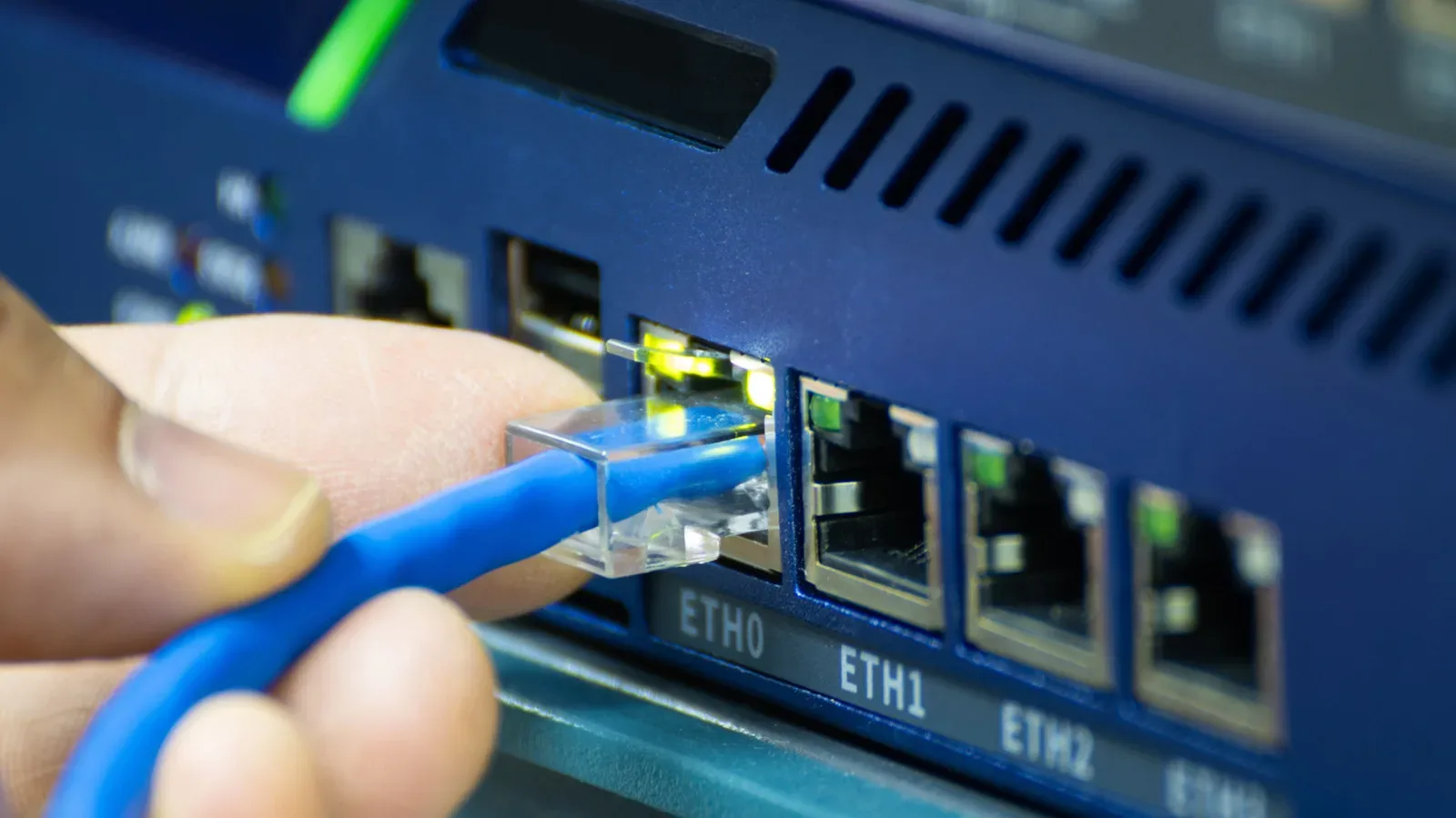 Compact Ethernet switch connected to a home router and gaming devices