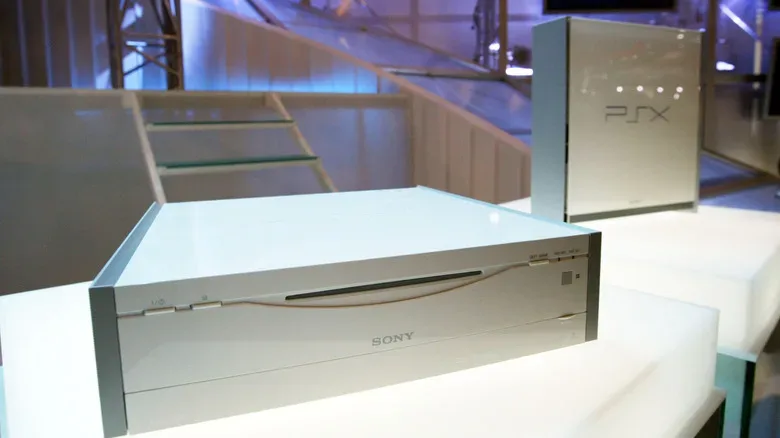 Japan-only Sony PSX console beside PlayStation 2 accessories