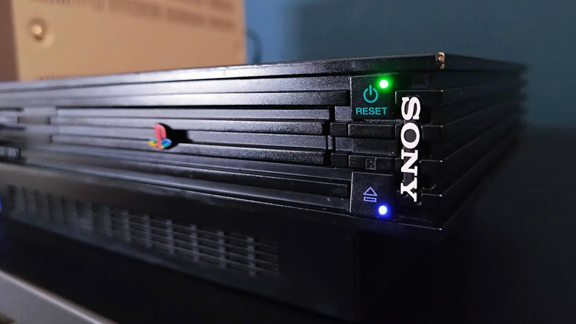 A PlayStation 2 console representing the MechaCon security-chip preservation breakthrough