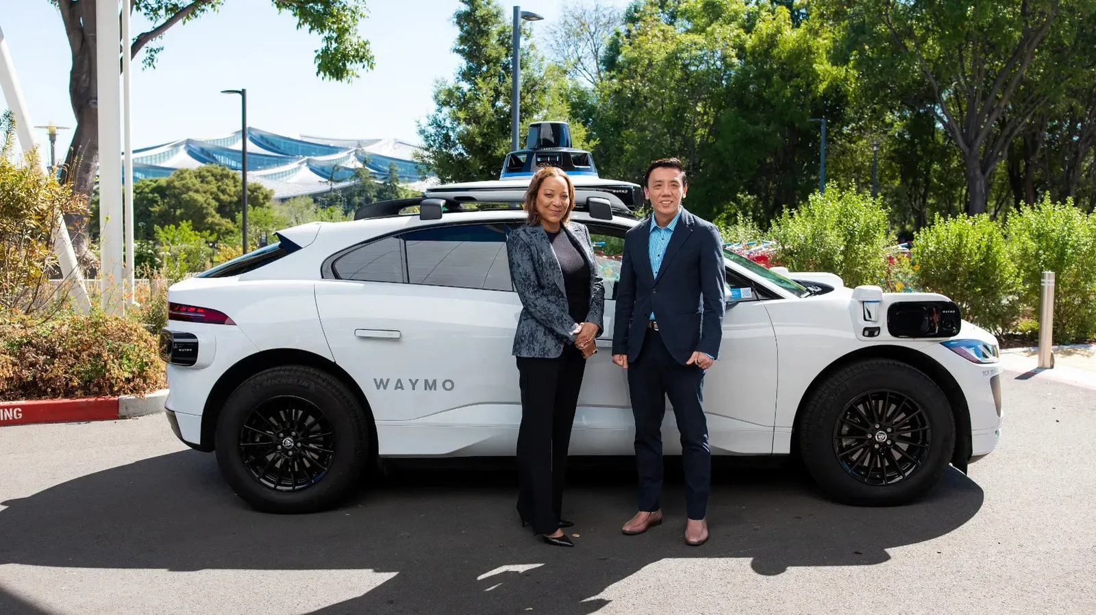 A Jaguar I-PACE vehicle travelling on a Singapore street during autonomous-service mapping preparations