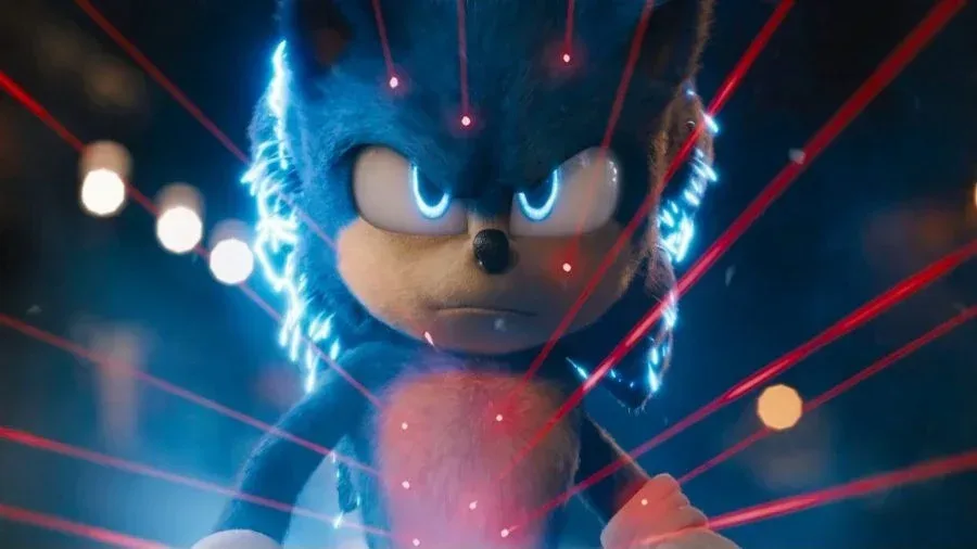 Sonic the Hedgehog running against a bright blue background