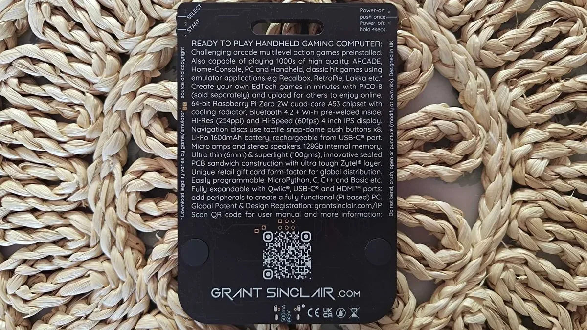 Gamercard handheld showing its stacked PCB design and built-in hang tag