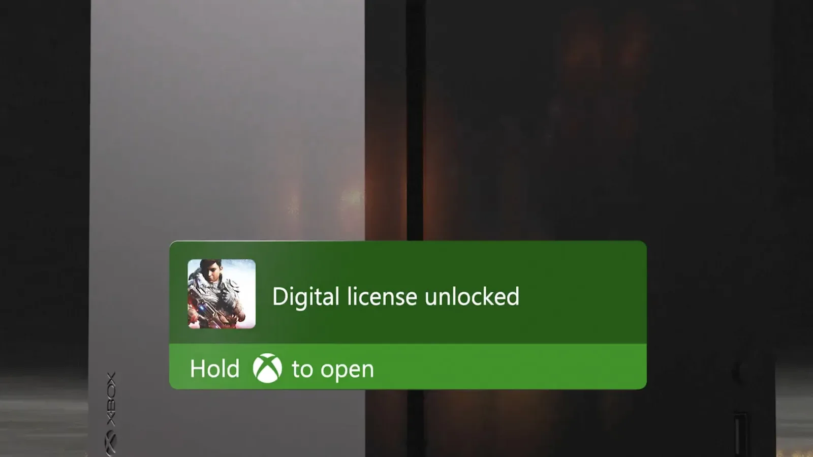 An Xbox game disc being inserted into a disc-drive-equipped Xbox console