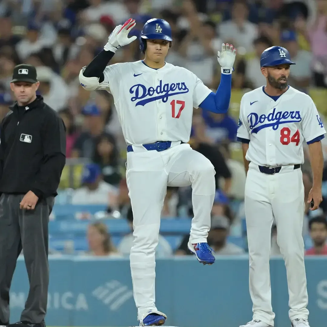 Shohei Ohtani celebrates after hitting a single for the Los Angeles Dodgers against the San Diego Padres at Dodger Stadium