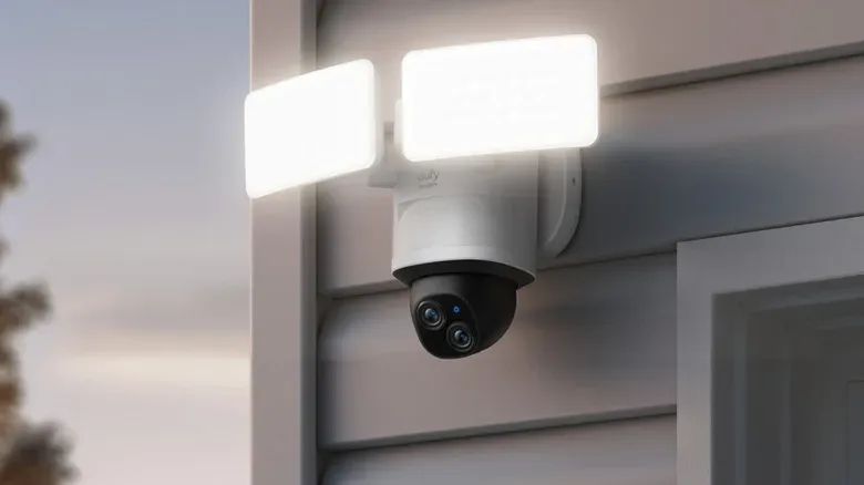 eufy Floodlight Camera E340 attached to outdoor wall with floodlights on.