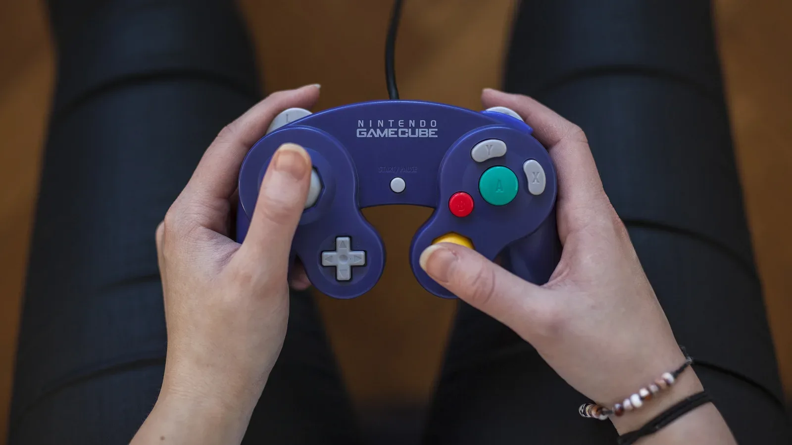 Nintendo GameCube console beside a modern gaming PC setup