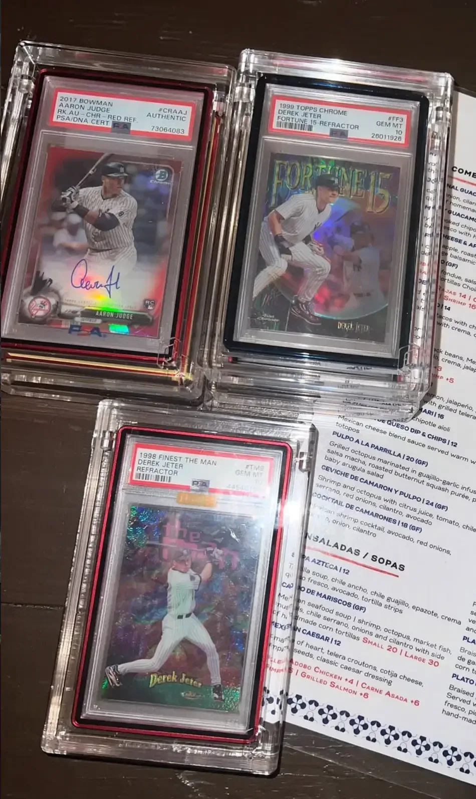 Custom card collection room with cards and unopened packs behind glass