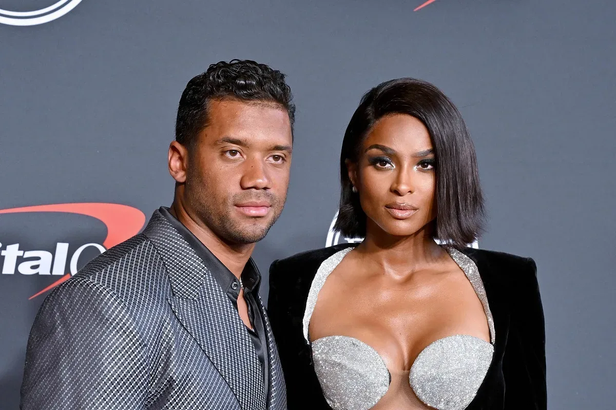 Ciara and Russell Wilson’s pregnancy announcement featuring shirts for their children and a blank onesie