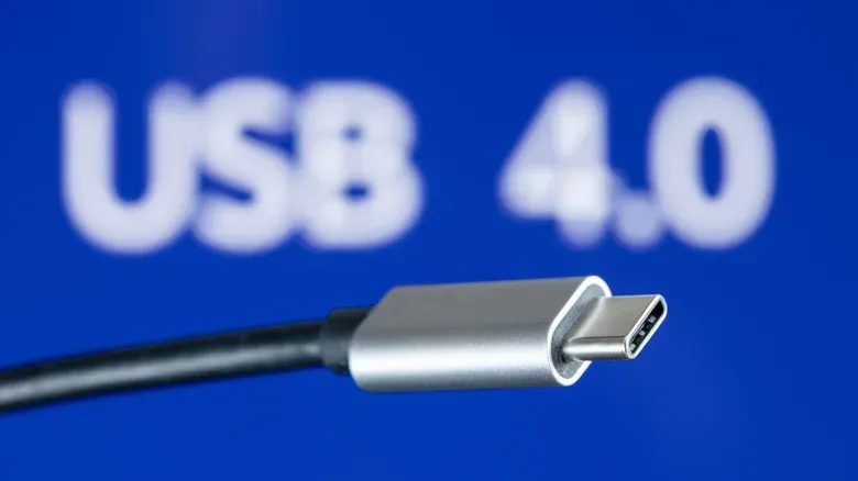 USB-C cable in front of a blue USB 4.0 background.