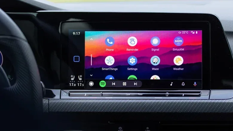 Car center console with a phone and cable-free infotainment controls